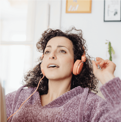 Women singing with headphone